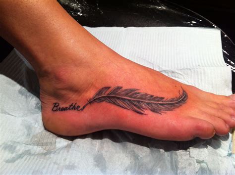 29 Delicate Feather Tattoo Designs. . Feather tattoos on the foot